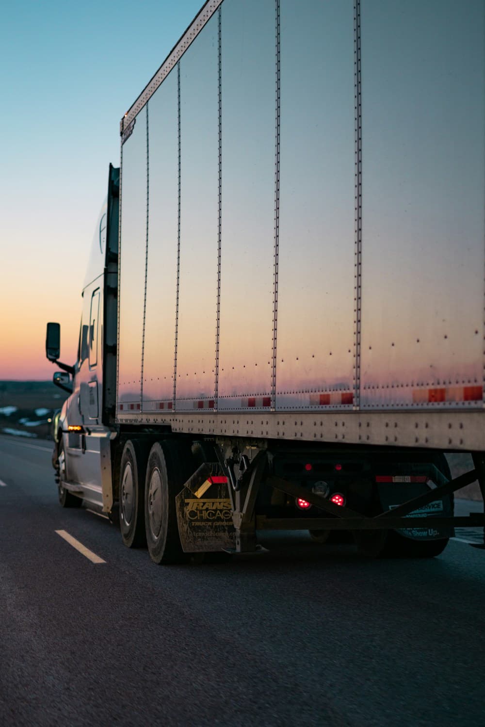 White freight truck on the road — Smart Highway Logistics transport operations